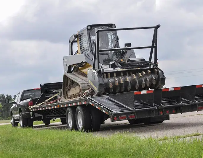 Heavy-duty pickup towing equipment with CURT products at a work site