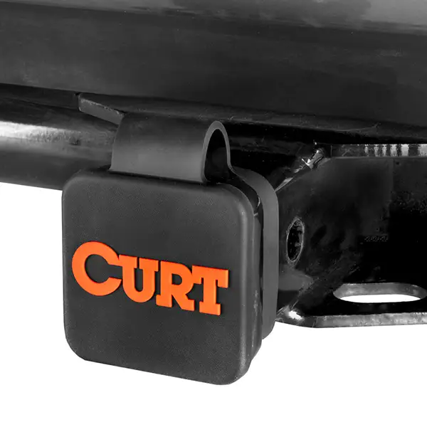 Orange and black CURT hitch cover with cap